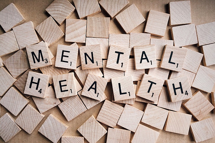 Scrabble pieces spelling "MENTAL HEALTH"
