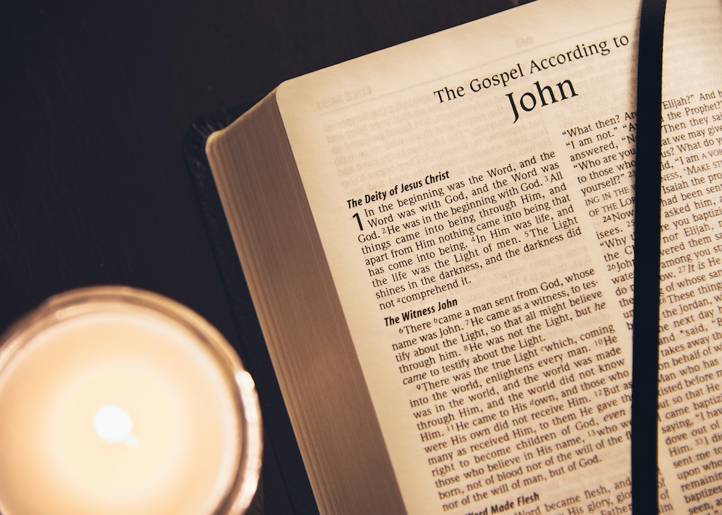Bible opened to "The Gospel According to John"